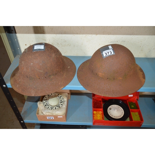 373 - 2 military helmets