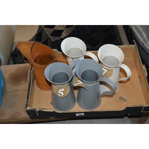 66 - box of metal jugs