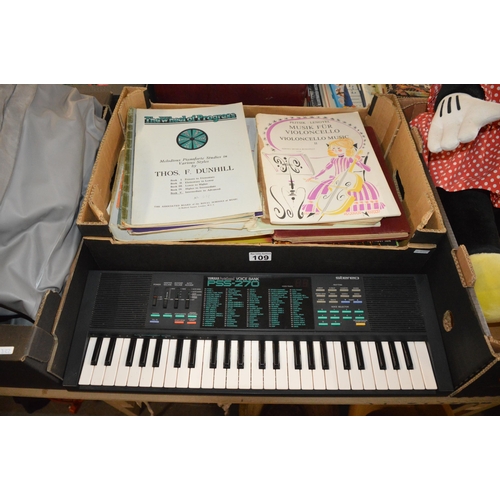 109 - yamaha keyboard & box of music sheets