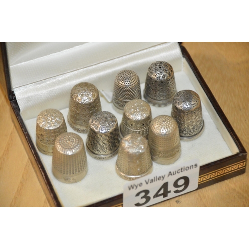 349 - 10 silver thimbles