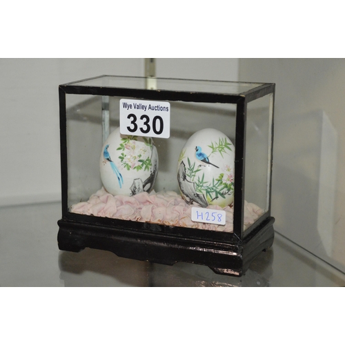 330 - pair of cased decorative eggs