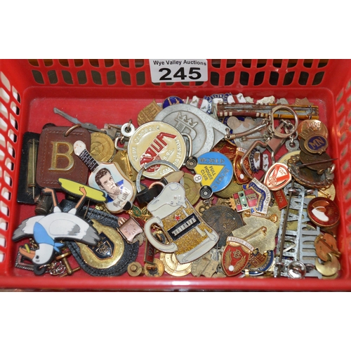 245 - crate of assorted pin badges etc.