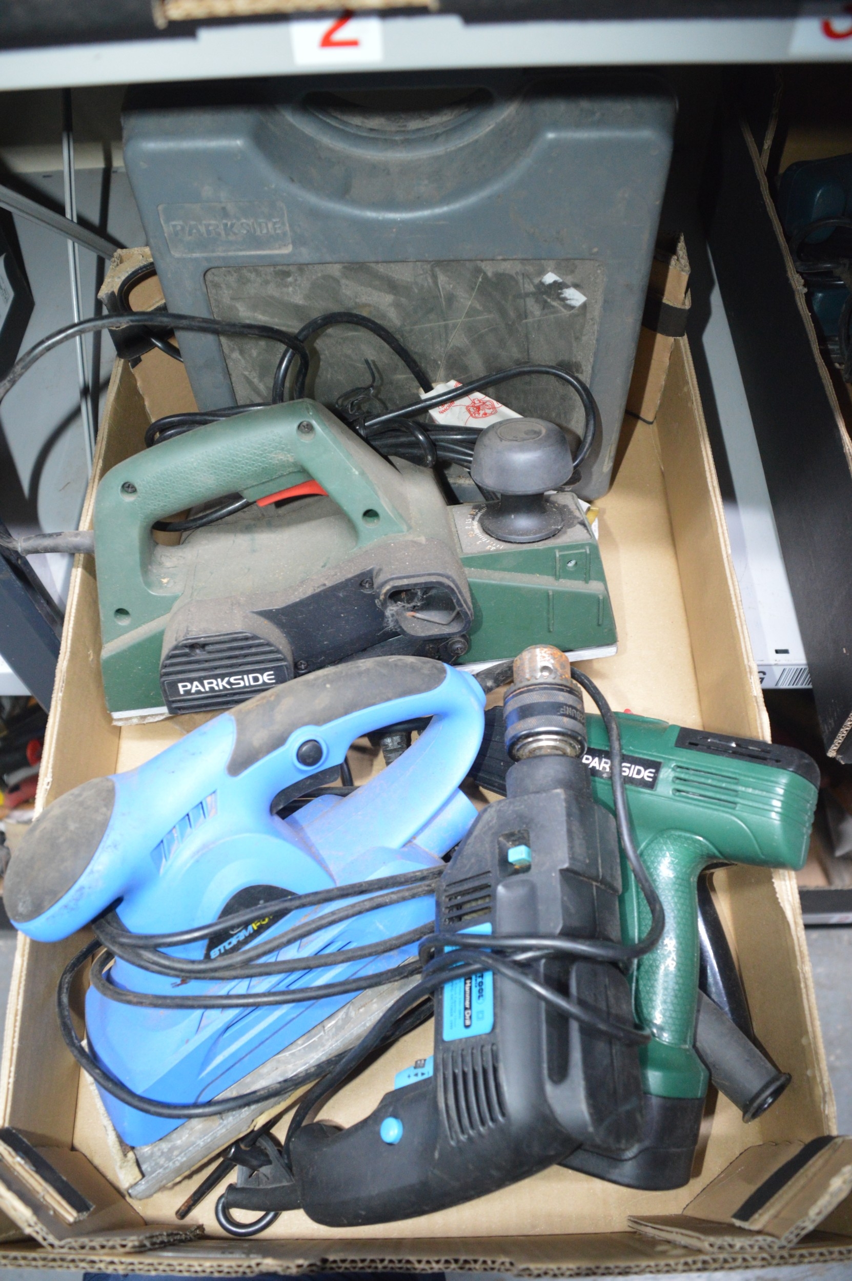 box of assorted power tools