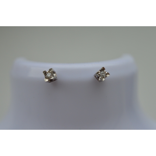 40 - Pair of 9ct gold diamond stud earings