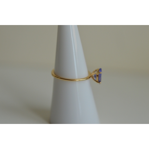 58 - 14ct gold tanzanite ring, size M