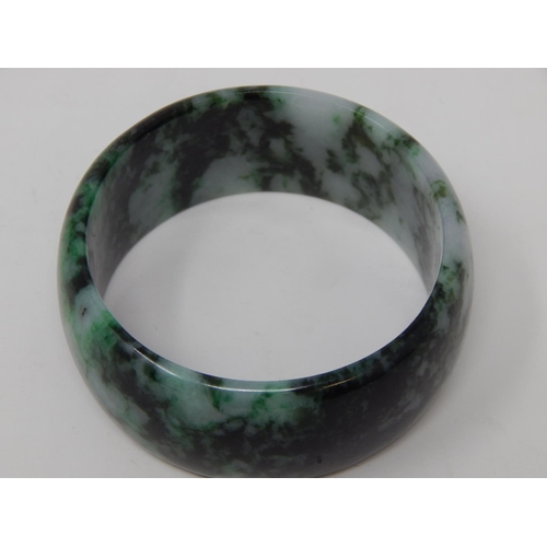 9 - Large Jade Bangle measuring approx. 7cm in diameter.