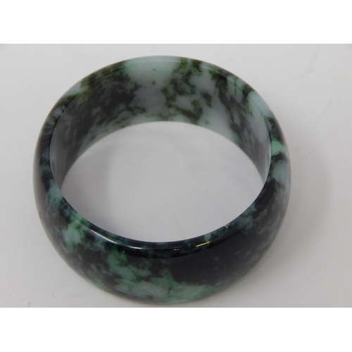 9 - Large Jade Bangle measuring approx. 7cm in diameter.