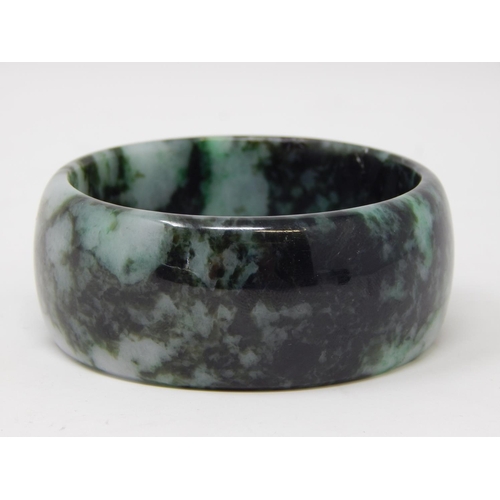 9 - Large Jade Bangle measuring approx. 7cm in diameter.