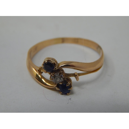 14 - Antique 18ct Gold Ring Inset with a central diamond & flanked by two sapphires. Ring size L.