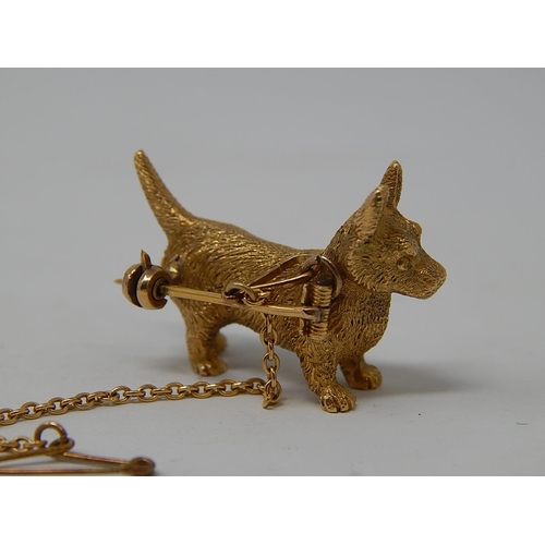 20 - Gold Cairn Dog Brooch on safety chain, unmarked but tests as 9ct. Commissioned by the vendors grandf... 