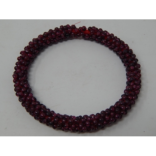 37 - Garnet Bead Necklace, length 70cm together with a Garnet Bead Bangle a/f.