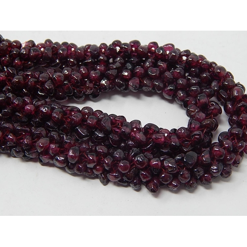 37 - Garnet Bead Necklace, length 70cm together with a Garnet Bead Bangle a/f.