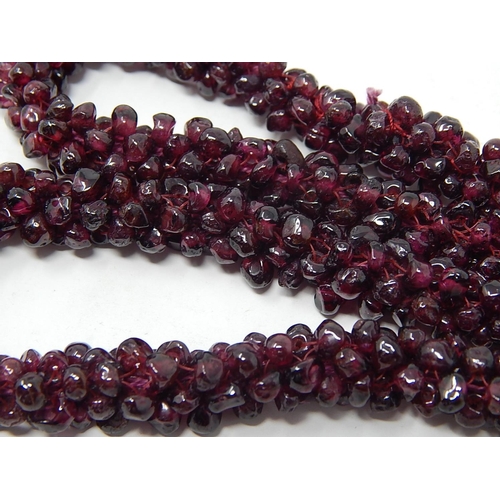 37 - Garnet Bead Necklace, length 70cm together with a Garnet Bead Bangle a/f.