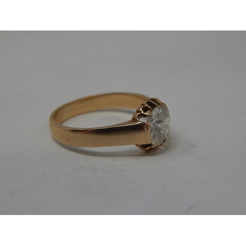 53 - Unmarked yellow metal ring set with a 1.18ct diamond