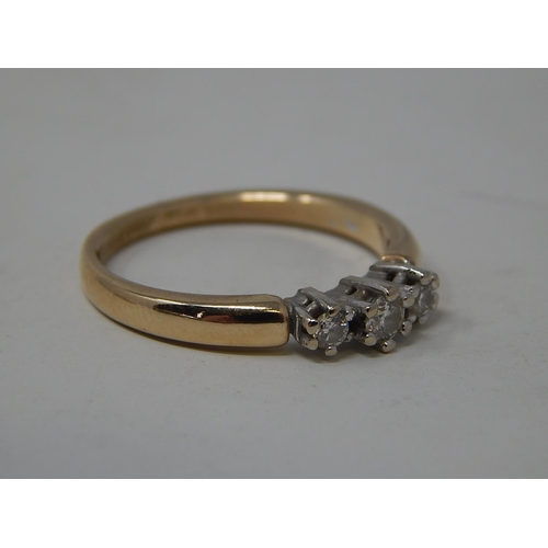 55 - 14ct yellow gold ring set three diamonds. 3.2g gross