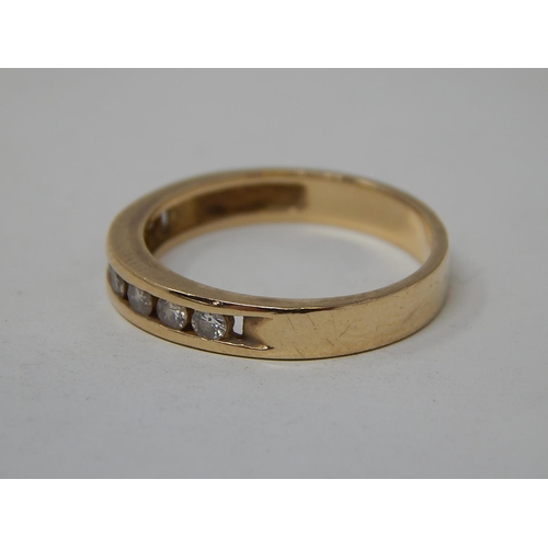 56 - 14ct yellow gold ring set seven diamonds. 2.5g gross