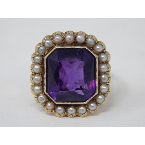 67 - Gold Ring, set Amethyst with seed pearl border. Size N