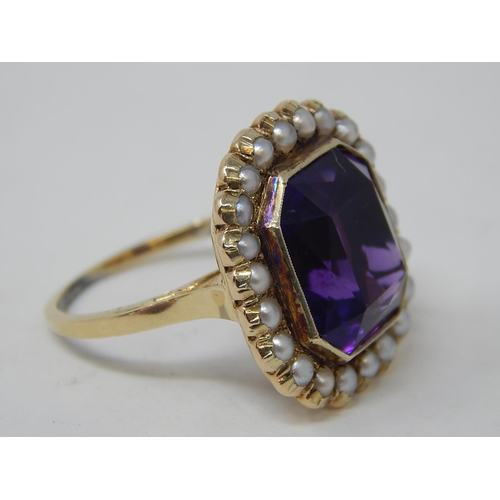 67 - Gold Ring, set Amethyst with seed pearl border. Size N