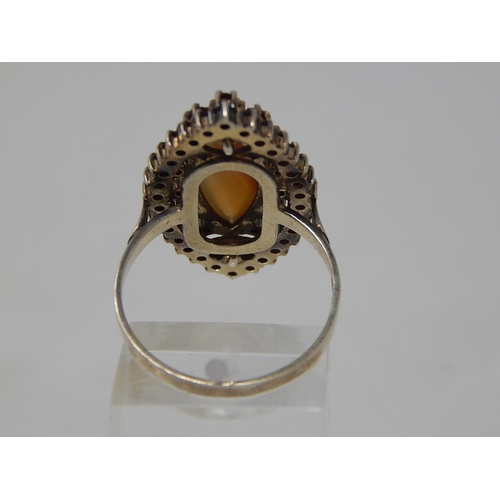 69 - Silver Gilt Ring, set central Agate with a Garnet Border. Ring size Q 1/2.