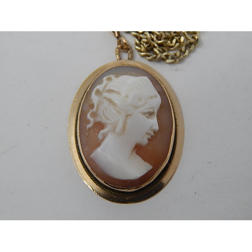 71 - A Gold Fine Flat Curb Link Chain with Cameo Pendant together with a pair of similar earrings.