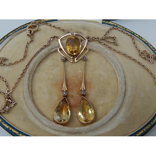 78 - A Gold Chandelier Pendant Necklace set 3 yellow Topaz & 4 seed pearls (Cased).