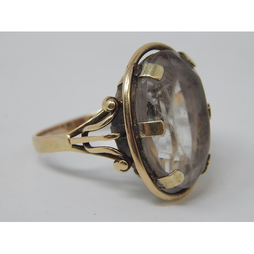 81 - A Gold Ring, set oval cut pale stone. 8.9g. Ring size P.