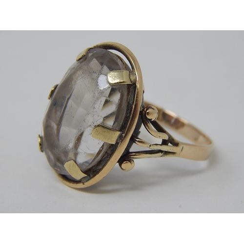 81 - A Gold Ring, set oval cut pale stone. 8.9g. Ring size P.