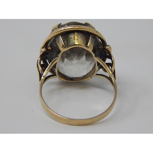 81 - A Gold Ring, set oval cut pale stone. 8.9g. Ring size P.