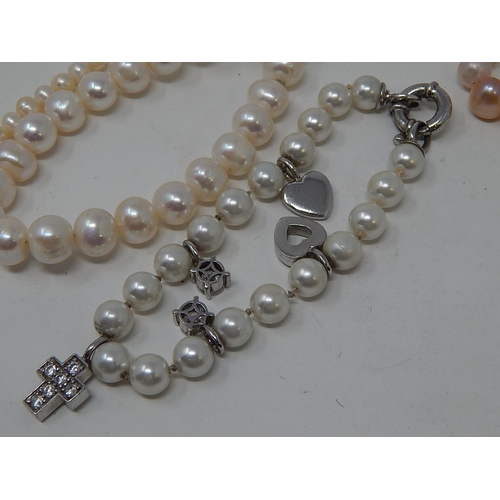 85 - Two Pearl Necklaces, Three Pearl Bracelets & a Charm Bracelet.