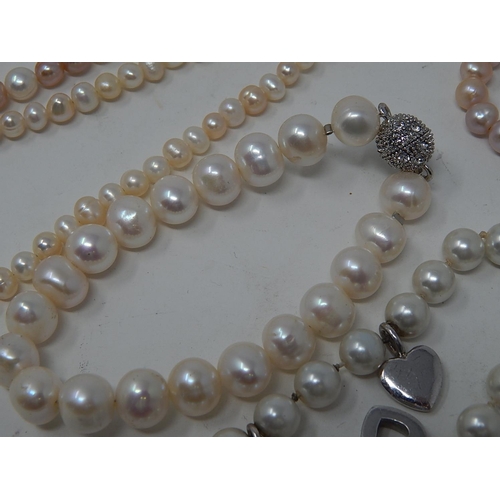 85 - Two Pearl Necklaces, Three Pearl Bracelets & a Charm Bracelet.