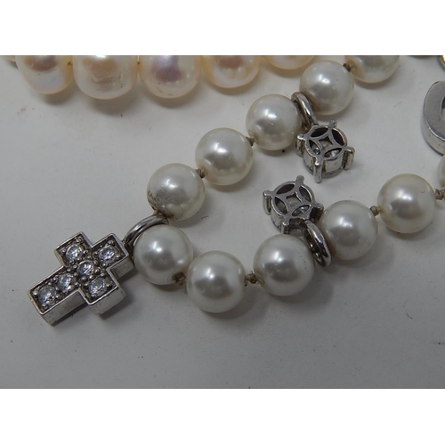 85 - Two Pearl Necklaces, Three Pearl Bracelets & a Charm Bracelet.