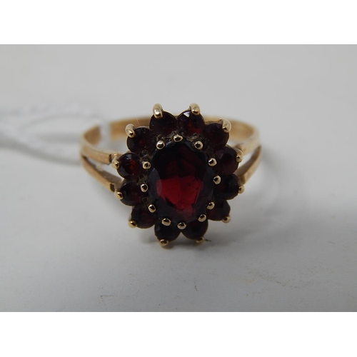 90 - WITHDRAWN: 9ct Gold Hallmarked Ring Inset with Garnets, Ring size M 1/2 in fitted presentation case.