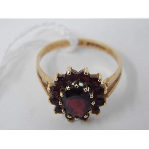 90 - WITHDRAWN: 9ct Gold Hallmarked Ring Inset with Garnets, Ring size M 1/2 in fitted presentation case.