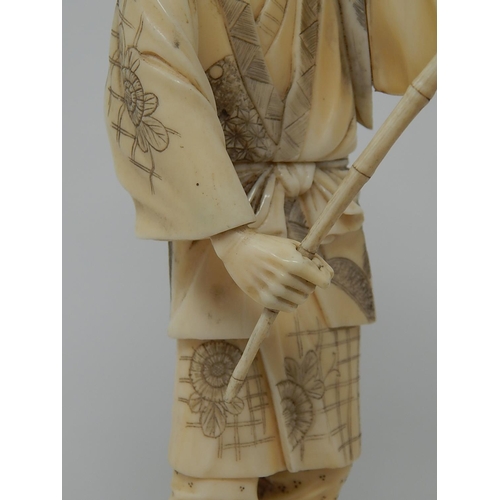 842 - Meiji (1868-1912) Japanese Ivory Figure, Signed to Base on Wooden Stand. The Figure 20.5cm High