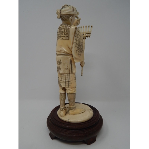 842 - Meiji (1868-1912) Japanese Ivory Figure, Signed to Base on Wooden Stand. The Figure 20.5cm High