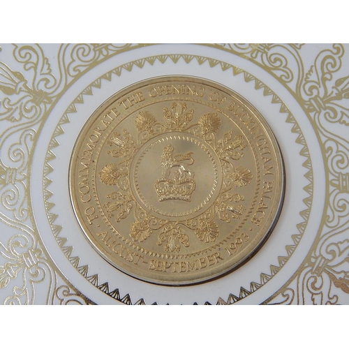 301 - Crown size medallion commemorating the opening of Buckingham Palace together with a Coronation 1/2 C... 