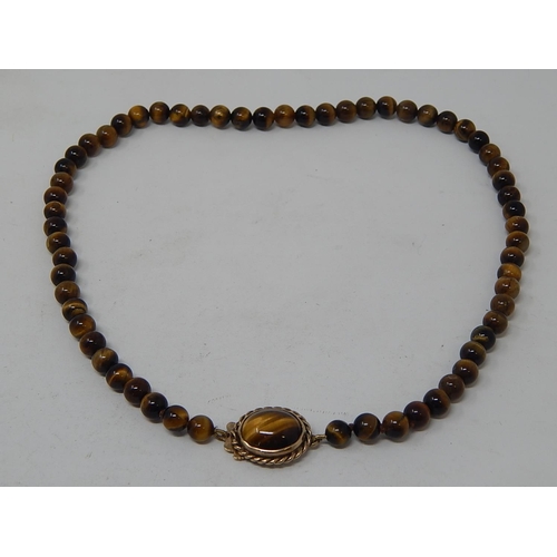 100 - Tigers Eye Necklace with 9ct Gold Hallmarked Clasp. Length 40cm.