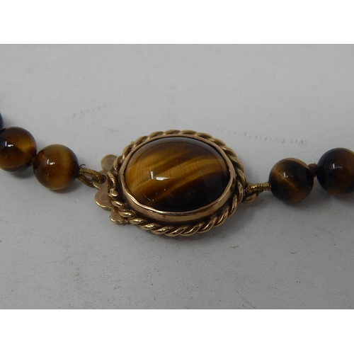 100 - Tigers Eye Necklace with 9ct Gold Hallmarked Clasp. Length 40cm.