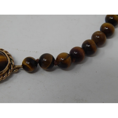 100 - Tigers Eye Necklace with 9ct Gold Hallmarked Clasp. Length 40cm.