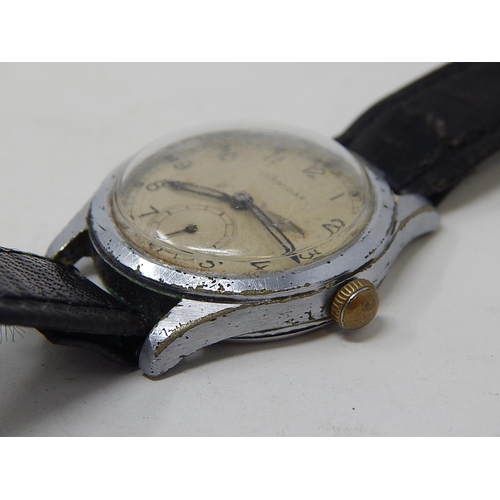 222 - Military: Gents Leonidas wristwatch, marked with broad arrow to back on leather strap.