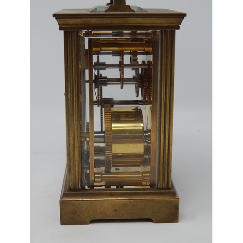 234 - Charles Frodsham Brass Carriage Clock with visible escapement, white dial with Roman numerals, compl... 