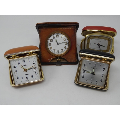 244 - Four Travelling Time Pieces in Folding Cases.