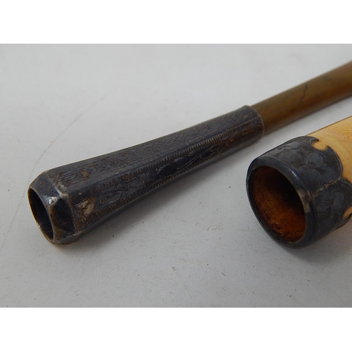 855 - Two early 20th Century Cigarette Holders, one with an amber mouth piece.