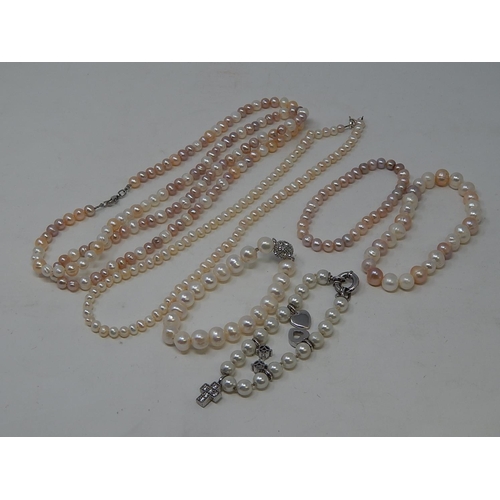 12 - Two Pearl Necklaces, Three Pearl Bracelets & a Charm Bracelet.