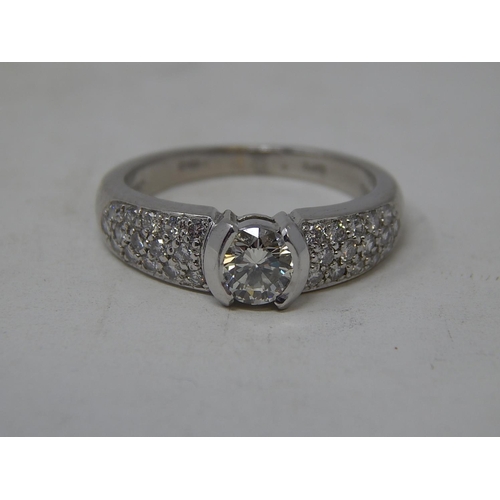 24 - Platinum 950, 1.4ct Diamond Ring Inset with a Central Diamond Approx. 0.80ct & Diamond Shoulders Set... 