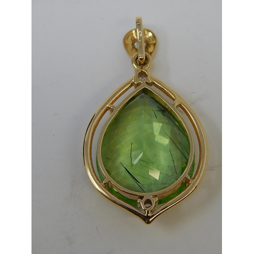 26 - Large Peridot & Diamond Pendant. Pear shaped Peridot weighing 23.82cts with a round brilliant cut di... 