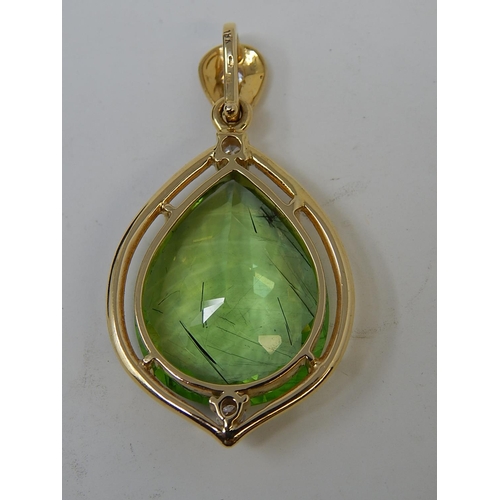 26 - Large Peridot & Diamond Pendant. Pear shaped Peridot weighing 23.82cts with a round brilliant cut di... 