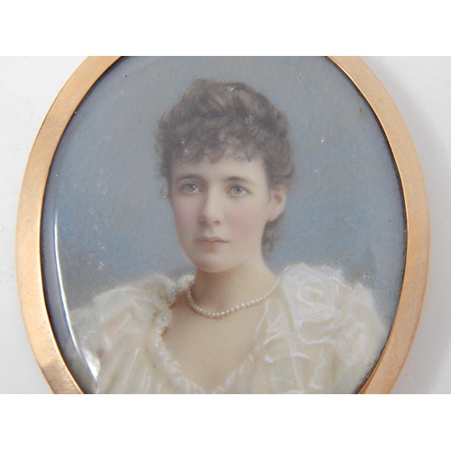 36 - Victorian Brooch / Pendant. The Painted Miniature of a pretty young Lady in a white dress wearing pe... 