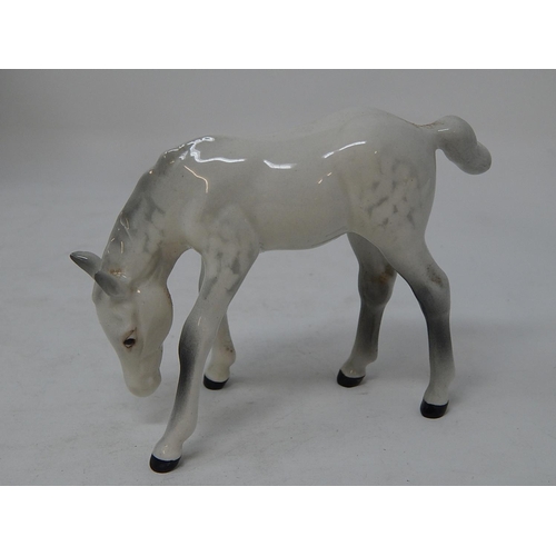 343 - Beswick: Seven Horses including the Huntsman within their original boxes/packaging together with a M... 