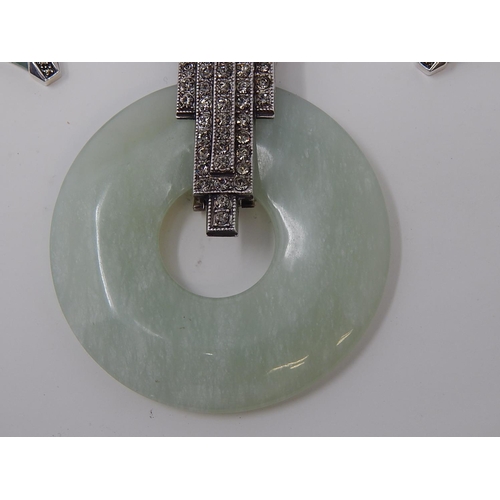 37 - French Art Deco Necklace with Jade coloured disc set with white stone mount on white metal chain tog... 